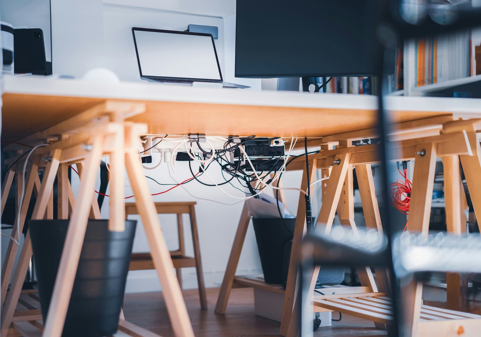 a desk with a laptop on top of it