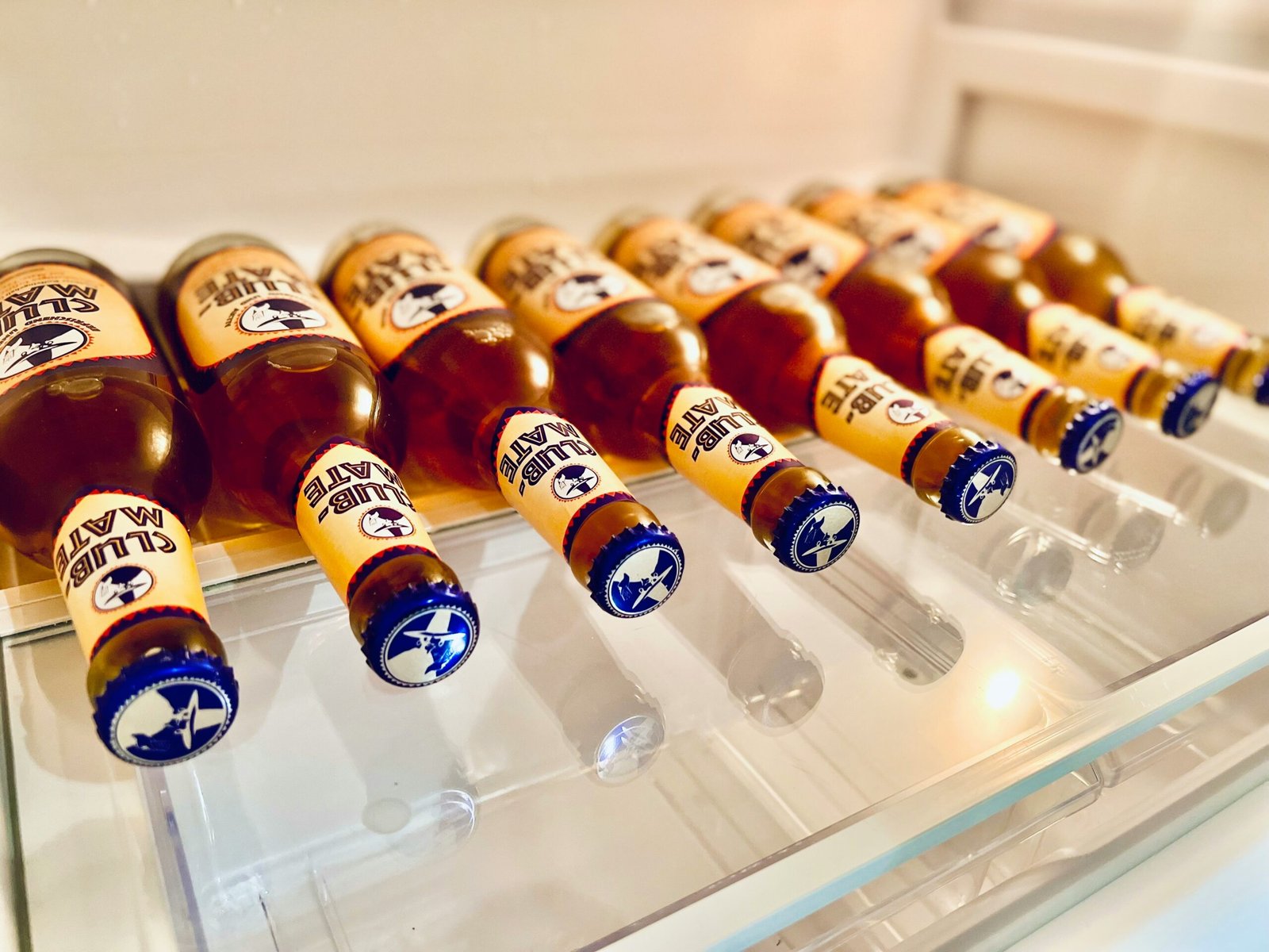 a display case filled with lots of bottles of beer